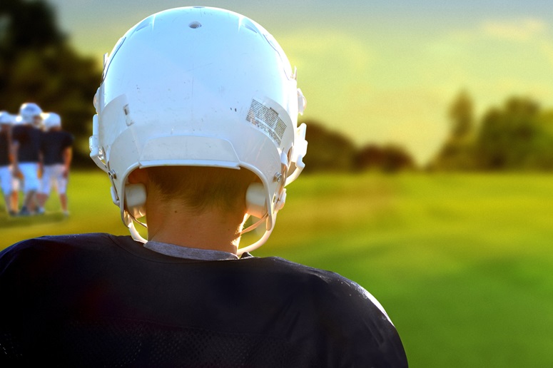 Youth in a football helmet