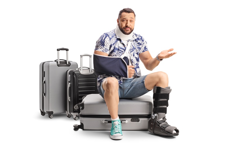 Injured man with travel bags