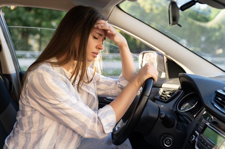 Driver holding her head